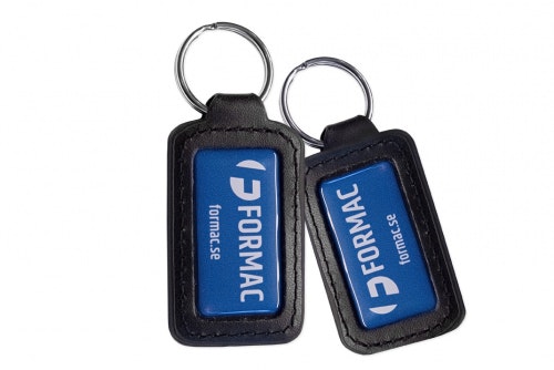 Key ring black leather, double-sided with 3D-emblem