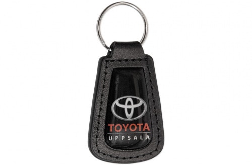 Key ring black leather, pear-shaped with 3D-emblem